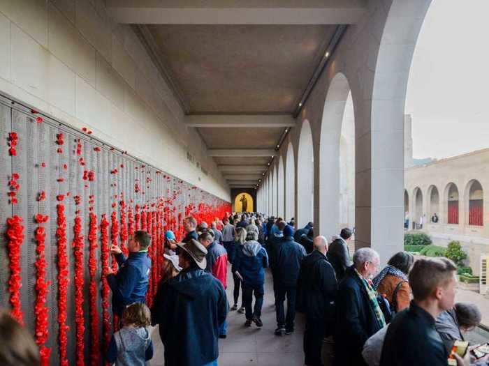 In previous years, crowds would line up to lay Flanders poppies into the walls of the memorial site at the Australian War Memorial.