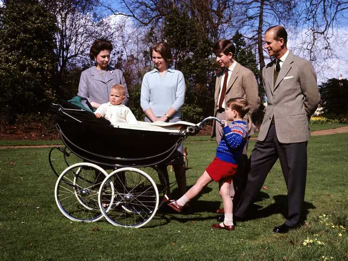 Prince Andrew, pictured holding his brother Edward