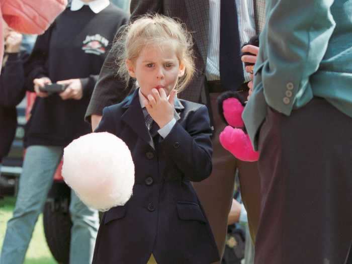 Princess Beatrice can be seen here at 5 years old enjoying some cotton candy at the Royal Windsor Horse Show.