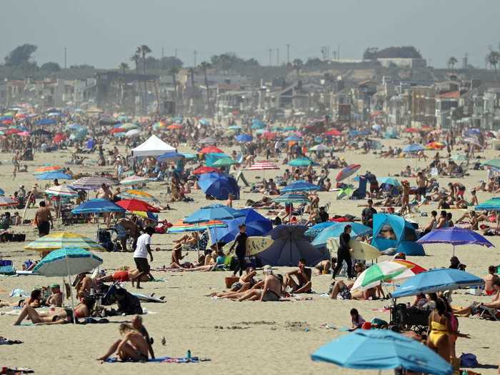 But not everyone agrees. "You would think it was summer," surfer Tom Cozad told Orange County Register. "Everyone has been locked up and they need to get out, but the city should plan for this. People are pulling up to the beach, getting out of Ubers, dropping off friends."