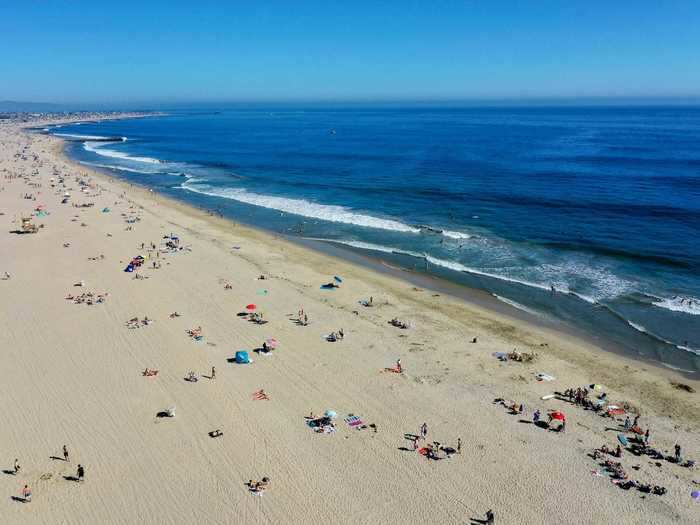 However, LA residents may not be staying put. Orange County Supervisor Lisa Bartlett said the beaches were inundated with people from LA and San Diego counties.