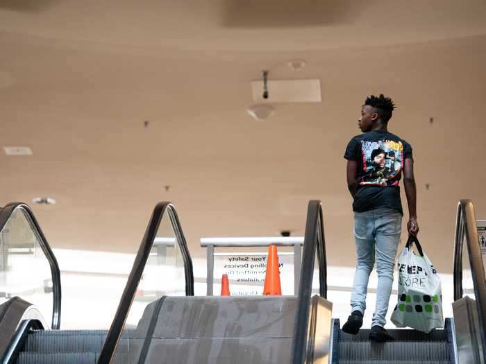 A shopper uses an escalator at Columbia Place Mall on April 24, 2020 in Columbia, South Carolina.