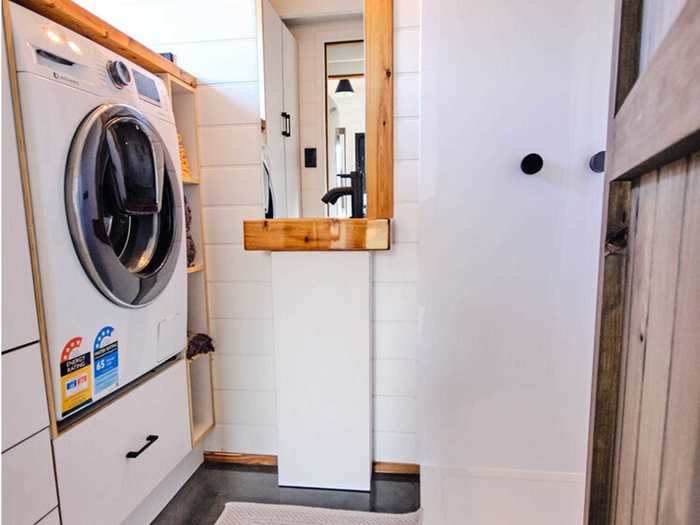 Unlike most mobile homes, the Grand Sojourner has the option to include a washer and dryer to accompany the closet space of drawers and a wardrobe.