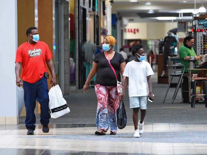 Some shoppers came wearing masks, like this group at the Anderson Mall in Anderson, South Carolina.