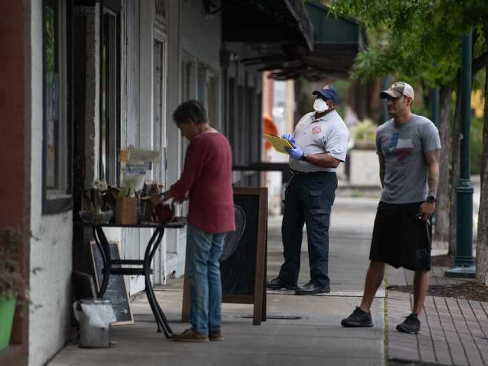 A fire department employee ensured the signs were being properly displayed in Columbia on Friday.