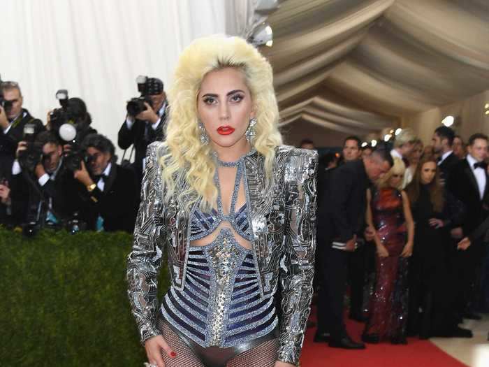 Leave it to Lady Gaga to show up in a fierce Versace ensemble complete with a leotard and a cropped metallic jacket.