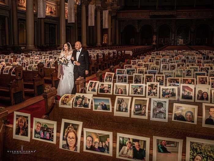 The photos of people taped to the pews are, in fact, regular churchgoers — not family and friends that couldn