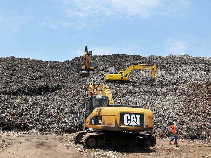 Even though fewer scavengers are able to work on the landfill, the trash keeps coming every day. Items that could once be sold to feed families in the villages are now being buried under heaps of new garbage.