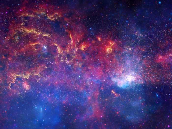 The center of our Milky Way galaxy contains a supermassive black hole called Sagittarius A* — the bright white spot on the right side of this photo.