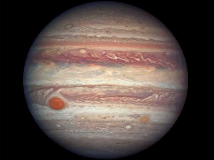 The largest planet in our solar system, Jupiter, has a trademark Great Red Spot that is roughly as wide as Earth.