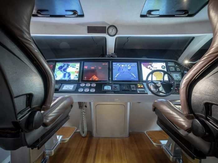 The helm station has seating for two, and is raised up above the rest of the yacht.