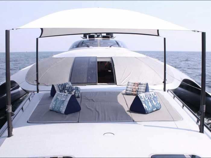 A sliding door at the front of the main saloon gives way to a covered lounging area on the bow.