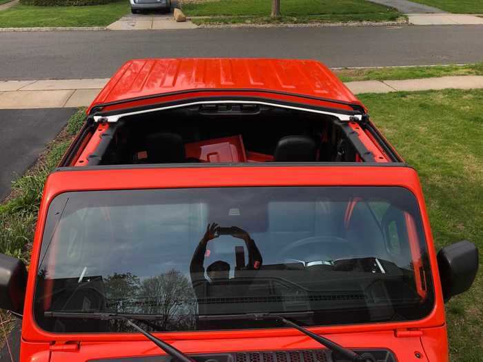 Throw a few latches and the entire room above the front seat can be removed. The rear roof is also removable, but it requires a small (included) tool kit.