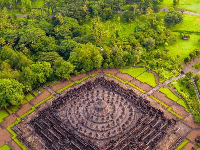 "Surrounded by 72 Buddha statues — The Great Candi Borobudur" by Risa Wicaksana