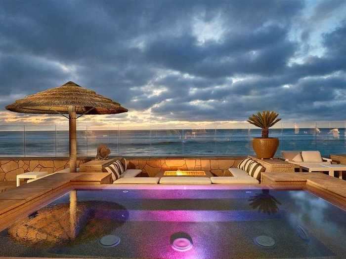 The jacuzzi and fire pit have everything for a perfect beachy respite.