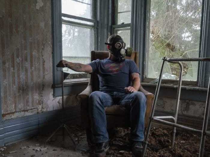 When exploring abandoned places, he wears protective equipment like a respirator.