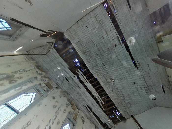 A photo taken during a visit in 2019 shows how most of the damage in the church is caused by water dripping through the roof.