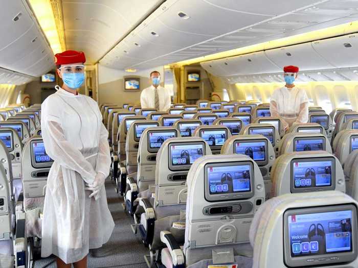 Emirates is doing the same for its flight attendants, offering disposable protective gear to be worn over existing uniforms.