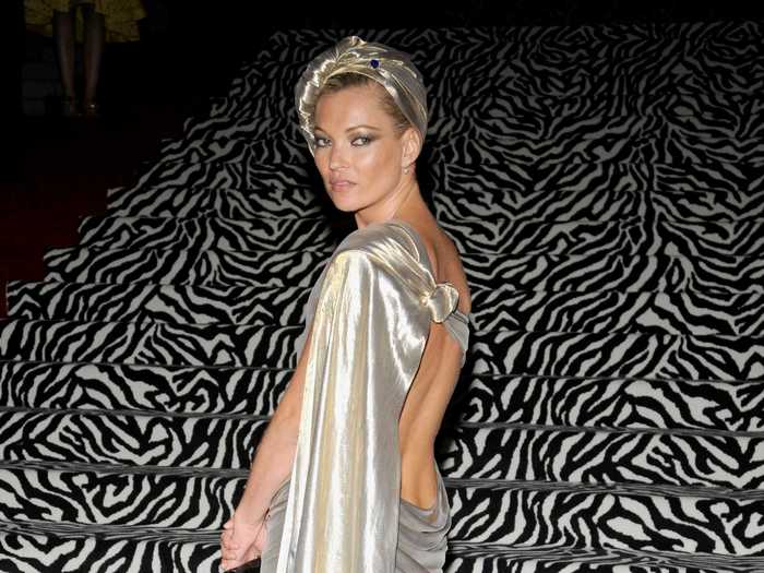 For "The Model As Muse" Met Gala in 2009, Kate Moss wore a shining silver gown.