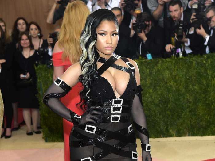 Nicki Minaj wore a bold dress covered in buckles to the same event.