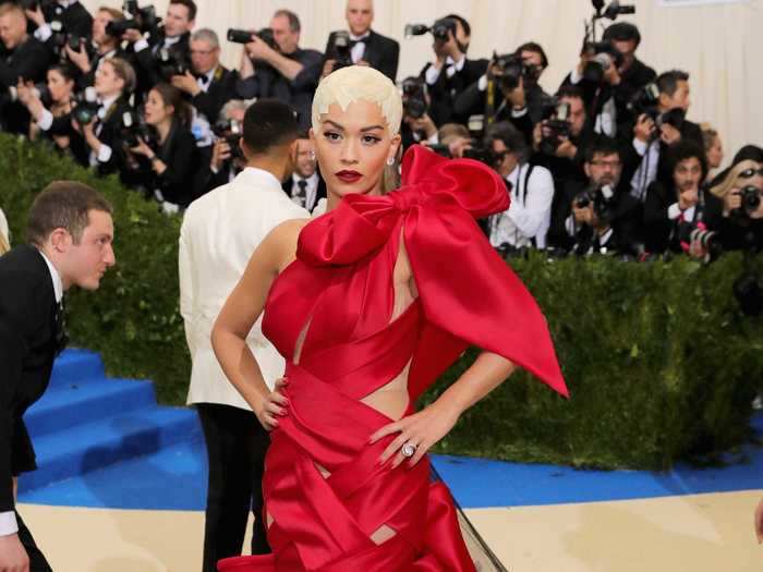 Rita Ora was wrapped in red ribbon at the same ball.