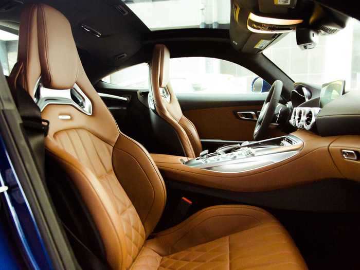 The interior is rendered in saddle-brown-and-black Nappa leather, along with a fair amount of carbon-fiber trim. Gorgeous.