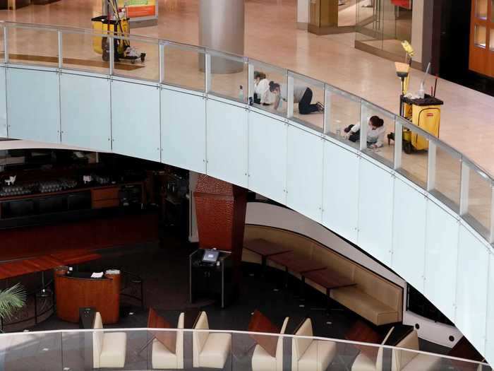 Workers scrubbing the floors of the Galleria Mall in Dallas, Texas.