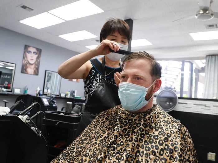 ... and this hair salon, where a customer came in for a trim on April 24. Salons and spas have not been officially reopened by the governor yet.