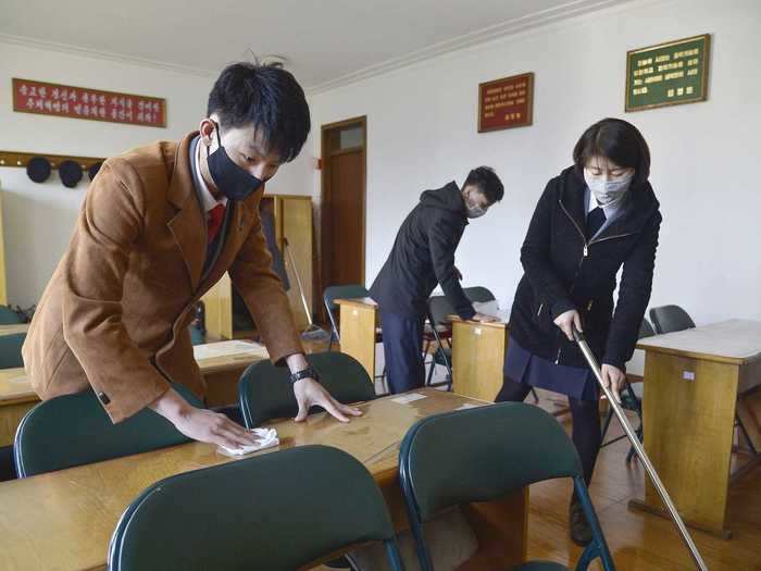 The students could also be seen cleaning their classrooms before taking their seats.