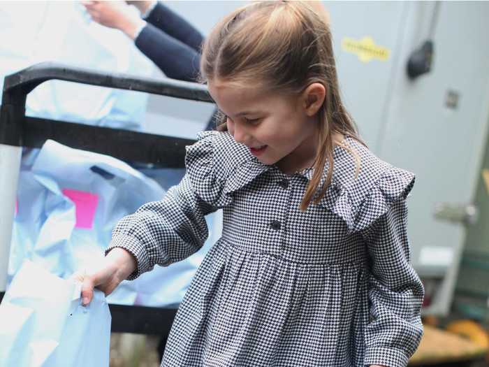 Princess Charlotte looked very put together in a houndstooth dress, grey tights, and well polished Mary Jane shoes.