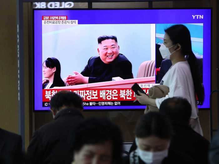 In the pictures, which could not be verified by Business Insider, the leader is seen smiling and waving on a podium in front of a crowd of people.