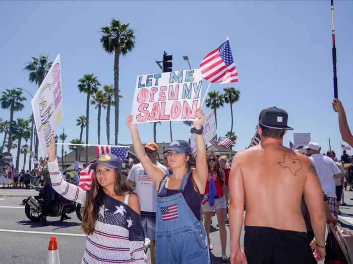 "Let me open my salon," added a women wearing dungarees featuring the US flag.