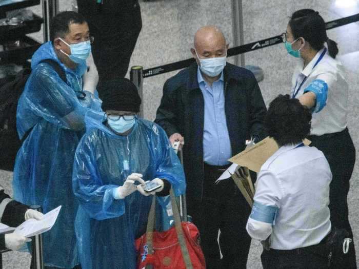 Authorities give out wrist bands with a QR code, and instruct wearers to download a corresponding app. They also receive handouts detailing consequences for breaking quarantine orders.