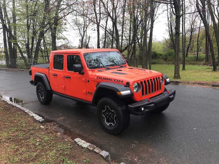 I tested a 2020 Jeep Gladiator Rubicon, with a sticker price of $62,020 (base price was $43,545, and cheapest Gladiator is the Sport trim, at $33,545). Cool feature number one is the snazzy orange paint job — "Punk