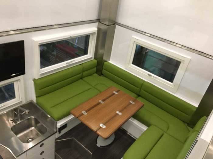 Meals made in the kitchen can be eaten at the dining booth that can seat six people.