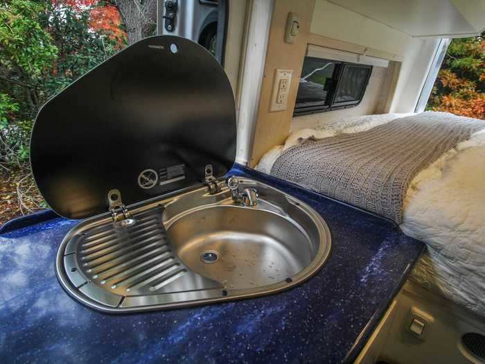 For meals on the road, the kitchen comes with a sink, single-burner stove …