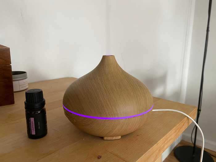 Then I plugged in an aroma diffuser and added lavender essential oil. It filled the air with a relaxing floral scent.