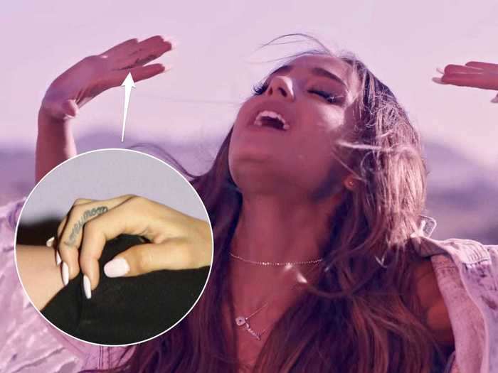  Grande has the word "honeymoon" on her right-hand middle finger. 