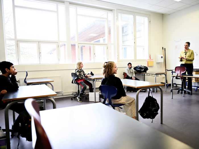 Desks are stationed six feet apart, and parents are no longer allowed inside school buildings