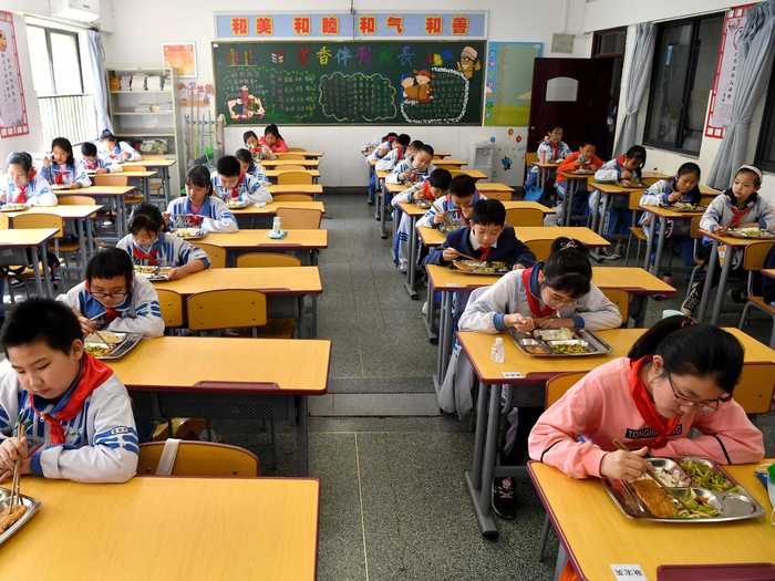 In some cafeterias, students are assigned seats and tables are spaced at least three feet apart