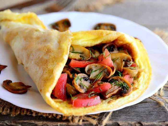 Clean out your fridge and boost your protein with a vegetable omelet.