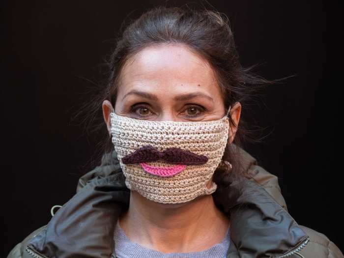 This crocheted mask has been given both a mustache and a smile.