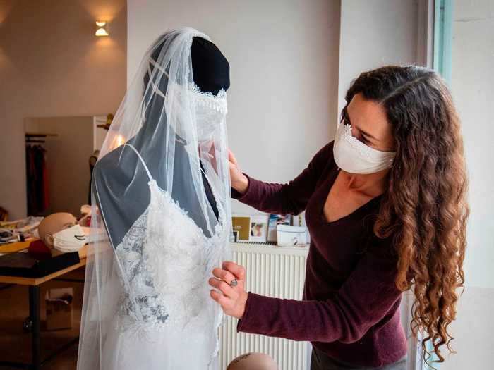 In addition to a veil, this wedding dress comes with a matching face mask.