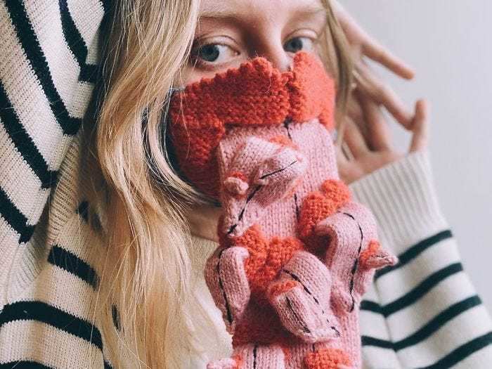 This crocheted face mask full of tongues is like a bizarre dream.