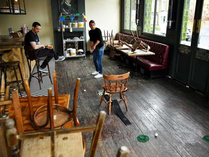 … playing golf in the spacious pub …