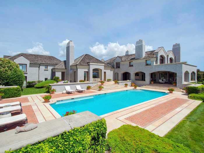 Tiered stone terraces lead to a 50-by-20 foot heated pool ...