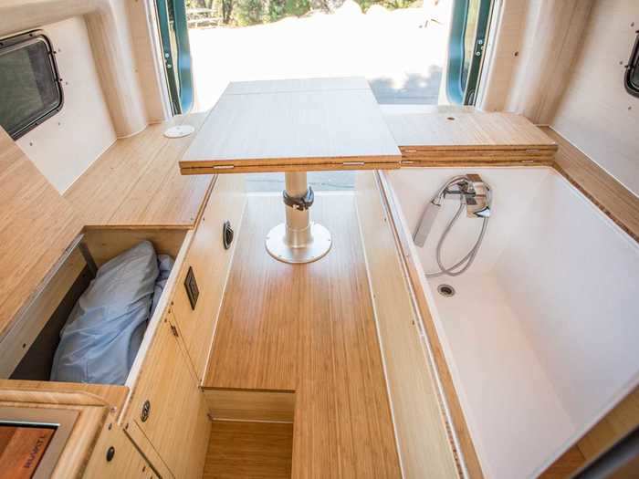 There are two water tanks — one with a 40-gallon capacity and the other with a 35-gallon limit — under each seating area bench to supply the soaking tub with water.