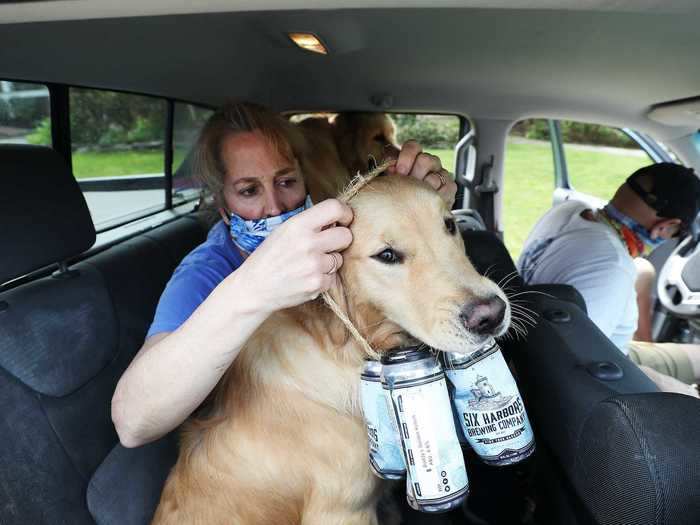 Though Buddy and Barley both carry makeshift four packs around their necks to symbolize the beer deliveries, the cans are all empty and Mark and Karen carry the actual load.