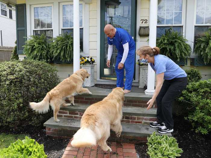 Here, Long Island Jewish Hospital Emergency Department technician Richard Fernandez looks delighted to see the pups.