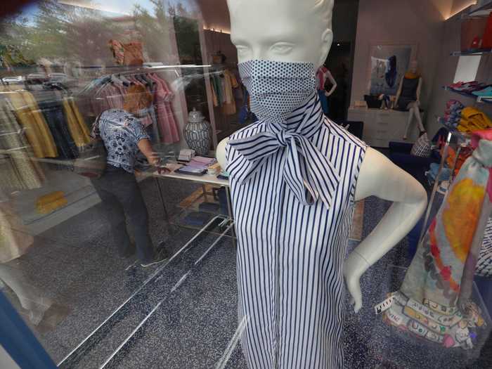 In a sign of the times, a mannequin was fitted with a fashion mask at Dallas